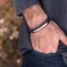 Stacked Black Leather Bracelets With Engraved Bar